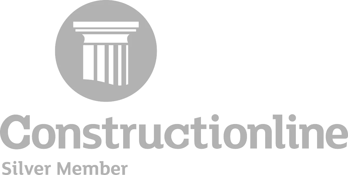 A black and white photo of a building with the words constructionline.